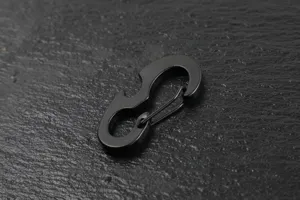 Black metal multi-function S-biner carabiner keychain with bottle opener EDC gear.