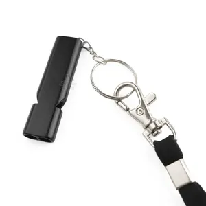 Black metal emergency whistle with lanyard and keychain, outdoor survival gear detail.