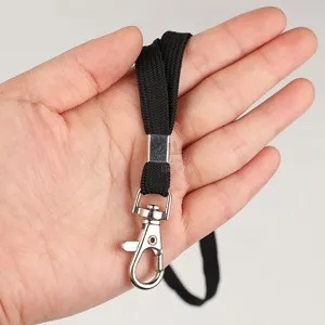 Black lanyard detail with metal hook and clasp for outdoor whistle and emergency gear.