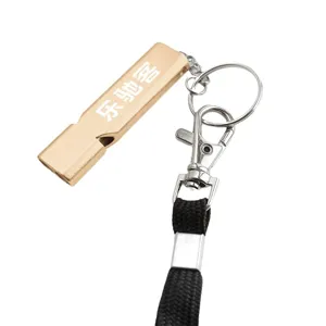 Gold metal emergency whistle with keyring, lobster clasp and black lanyard for outdoor survival.