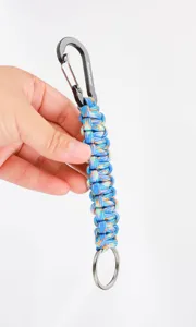 Detail view of the colorful paracord keychain featuring a sturdy black carabiner and ring.