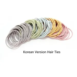 Close-up of seamless slim elastic hair ties in assorted pastel colors for daily use.