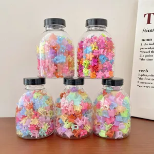 Five transparent jars filled with colorful assorted mini claw hair clips for girls