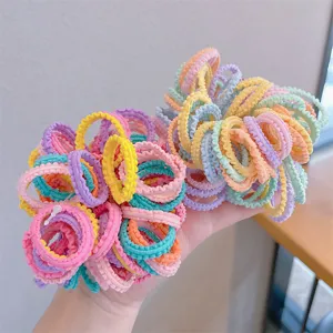 Colorful macaron ruffled elastic hair bands showing vibrant texture and variety.