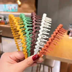 Set of five colorful anti-slip zigzag headbands with teeth for face washing and hair styling.