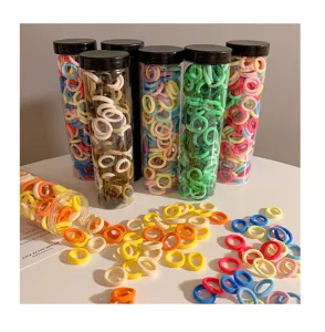 Bulk set of colorful seamless hair ties for girls in clear storage tubes