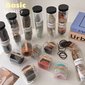 Multi-color seamless hair ties set in clear boxes and tubes