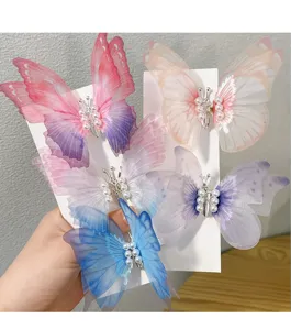 Detail of 5 colorful butterfly hair clips with pearls and double-layer gauze wings