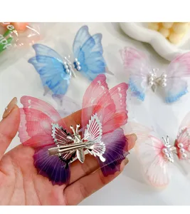 Detailed back view of a moving butterfly hair clip with pearls
