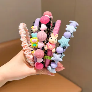 Close-up detail of colorful children's headbands featuring star, heart, and rabbit charms