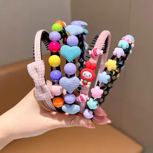 Close-up of colorful children's headbands with cute heart and star decorations