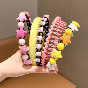 Detailed view of colorful children's headbands with star and bunny charms