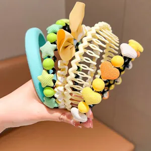 Close-up of colorful children's headbands and hair combs with cute heart and star decorations