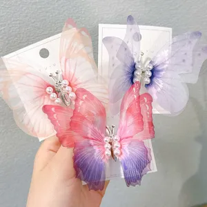 Set of three colorful gradient mesh butterfly hair clips decorated with pearls