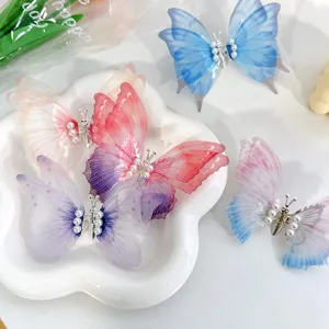 Sweet moving butterfly hair clips with pearl accents for girls hair style accessories