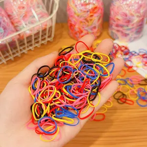 Colorful high elastic rainbow rubber hair bands for kids shown in a handheld display.