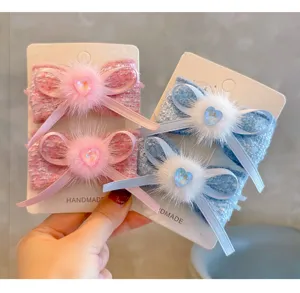 Elegant handmade French tweed bow hair clips with soft mink fur and sparkly heart crystal