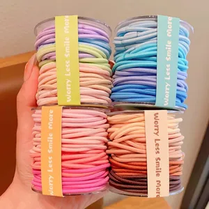 Colorful elastic hair ties set with "Worry Less Smile More" labels, high stretch hair bands.