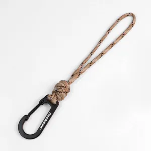 Handwoven paracord keychain lanyard with black metal carabiner clip for outdoor camping.
