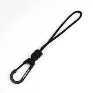 Close-up detail of the hand-woven paracord keychain lanyard with black metal carabiner hook.