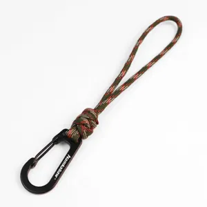 Detailed view of the handmade paracord keychain lanyard with a black metal carabiner hook.