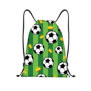 Close-up view of a green striped drawstring bag with soccer ball and golden crown pattern
