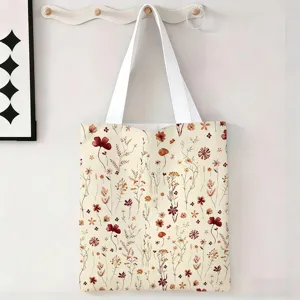 Detalle de la bolsa de lona grande con un estampado floral botánico vintage en crema