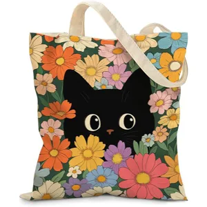 Vista detallada de un bolso de lona resistente con un gato negro y diseño floral vibrante
