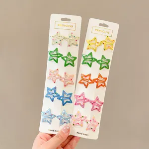 Detailed view of twenty colorful star-shaped BB hair clips for children on white cards