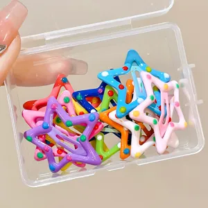 Close-up view of vibrant star-shaped BB hair clips for girls in a clear storage box