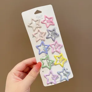 Detailed view of colorful star-shaped BB hair clips on white card packaging