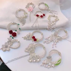Detailed assortment of floral tassel hair clips and bird's nest bun holders for women