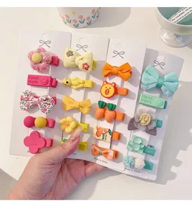 Close-up of colorful cute cartoon hair clips set for baby girls