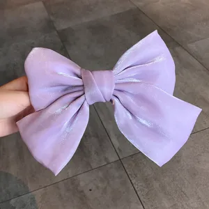 Elegant lavender pearlescent satin bow hair clip with a mermaid finish for women