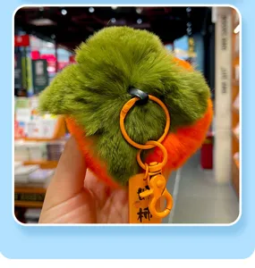 Detailed macro view of soft orange plush rabbit fur persimmon keychain charm