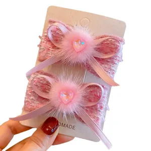 Handmade pink tweed hair clips with fluffy mink fur bows and sparkling heart crystals
