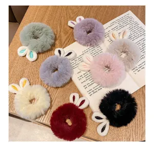 Collection of soft plush hair scrunchies with cute rabbit ears in vibrant colors