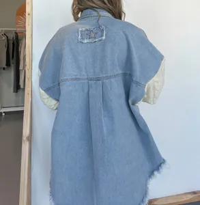 Loose denim jacket with knit sleeves, featuring a frayed star patch on the back for a trendy look.