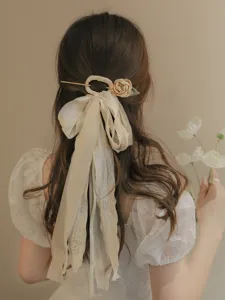 Elegant ancient style hair stick with fabric flower and long ribbons detail view