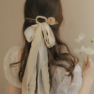 Elegant ancient style hairpin featuring a long beige chiffon ribbon and flower detail