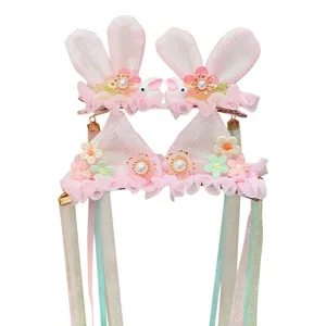 Sweet pink rabbit ear hair clips with floral accents and long gradient ribbons for girls