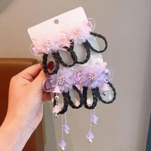 Detailed view of traditional Chinese floral hair clips with braided faux hair extensions