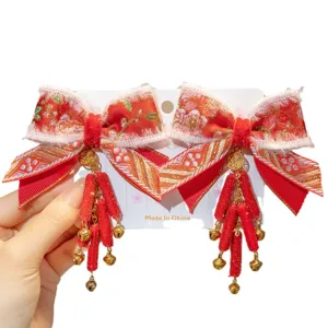 Traditional Chinese style festive red bow hair clips with golden bells for girls