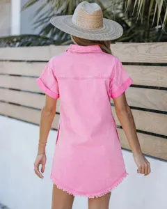 Back detail view of pink short-sleeve denim shirt dress with fringe hem and classic collar.