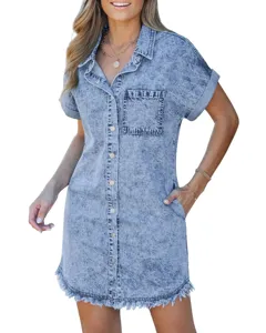 Detailed view of the short sleeve denim shirt dress with button-down and frayed hem.