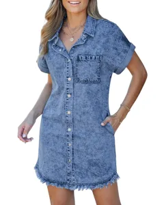 Detail view of the stylish short sleeve denim shirt dress with chic frayed hem and pockets.