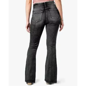 Detail view of women's vintage dark grey mid-rise flare denim jeans, showing the back pockets.