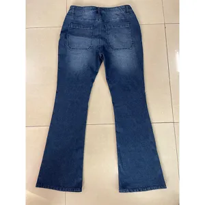 Back view detail of women high waist denim flare pants with back patch pockets wash blue.