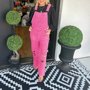 Women pink corduroy overalls casual distressed bib trousers with pockets and ripped knees.