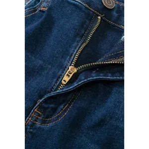 Dark blue denim jeans detail shot, classic metal zipper and contrast stitching design.